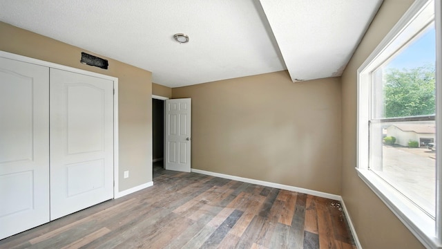 3554 Morning Dew Ct Unit 11, Memphis, TN 38118 - unfurnished bedroom featuring baseboards, wood finished floors, and a closet