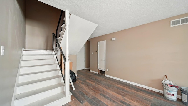 3554 Morning Dew Ct Unit 11, Memphis, TN 38118 - stairway featuring hardwood / wood-style flooring, baseboards, and a textured ceiling