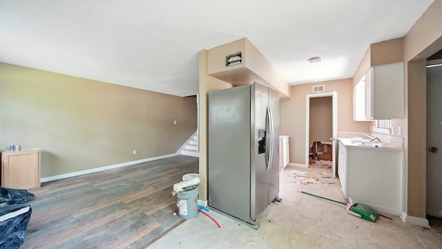 3554 Morning Dew Ct Unit 11, Memphis, TN 38118 - kitchen with stainless steel fridge with ice dispenser, light countertops, and a sink