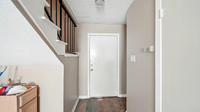 3554 Morning Dew Ct Unit 11, Memphis, TN 38118 - doorway featuring dark wood-type flooring, a textured ceiling, baseboards, and stairway