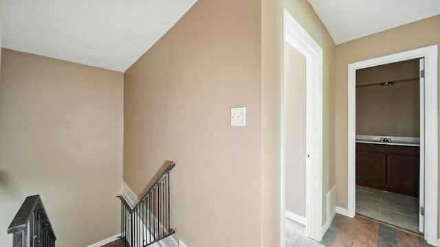 3554 Morning Dew Ct Unit 11, Memphis, TN 38118 - hall with an upstairs landing, a sink, and baseboards