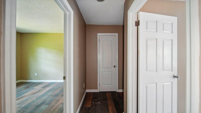 3554 Morning Dew Ct Unit 11, Memphis, TN 38118 - hall featuring dark wood finished floors, baseboards, and a textured ceiling