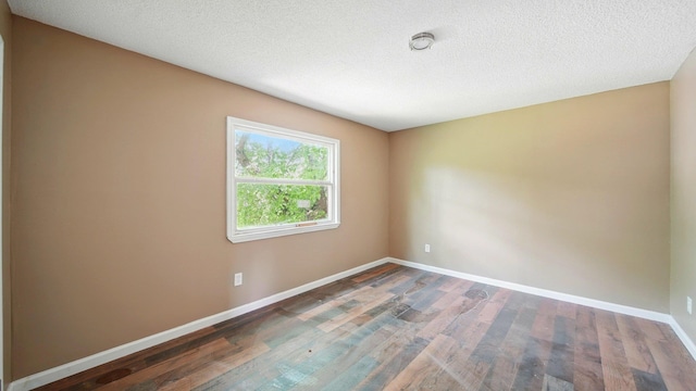 3554 Morning Dew Ct Unit 11, Memphis, TN 38118 - empty room featuring wood finished floors, baseboards, and a textured ceiling