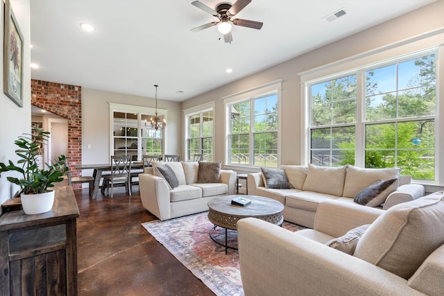 6978 Vaiden Rd, Hernando, MS 38632 - living room with finished concrete floors, a ceiling fan, a chandelier, and recessed lighting