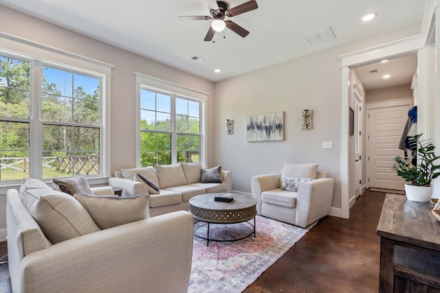 6978 Vaiden Rd, Hernando, MS 38632 - living room featuring concrete flooring, ceiling fan, baseboards, and recessed lighting