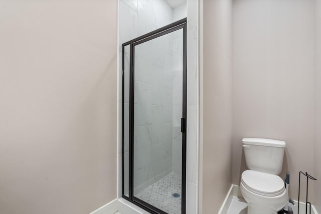 6978 Vaiden Rd, Hernando, MS 38632 - bathroom featuring baseboards, a marble finish shower, and toilet