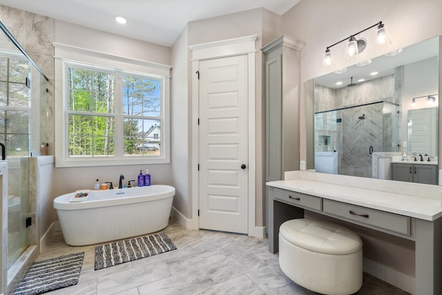 6978 Vaiden Rd, Hernando, MS 38632 - bathroom with a stall shower, vanity, a freestanding tub, baseboards, and marble finish floors