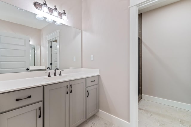 6978 Vaiden Rd, Hernando, MS 38632 - full bathroom featuring baseboards, marble finish flooring, vanity, and an enclosed shower