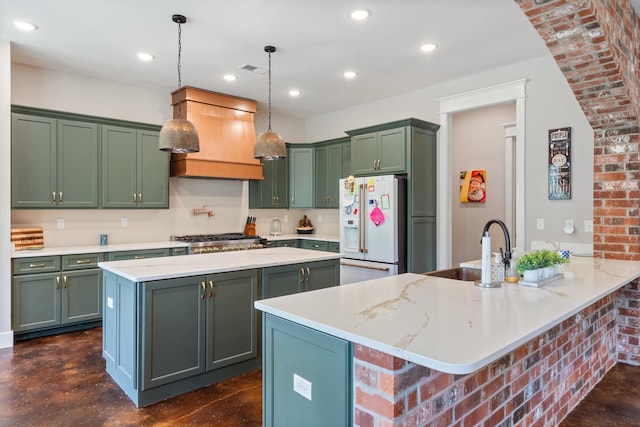 6978 Vaiden Rd, Hernando, MS 38632 - kitchen featuring white fridge with ice dispenser, a kitchen island, green cabinets, recessed lighting, and light stone counters