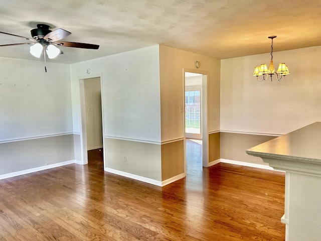182 Hargett Dr, Ripley, TN 38063 - unfurnished room featuring wood finished floors, a chandelier, baseboards, and ceiling fan