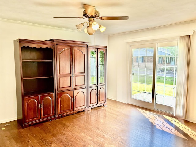 182 Hargett Dr, Ripley, TN 38063 - unfurnished living room with wood finished floors, baseboards, a ceiling fan, and ornamental molding
