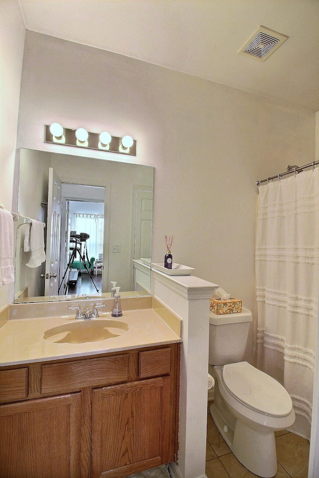 1079 River Isle Dr, Memphis, TN 38103 - bathroom with toilet, tile patterned flooring, vanity, and curtained shower