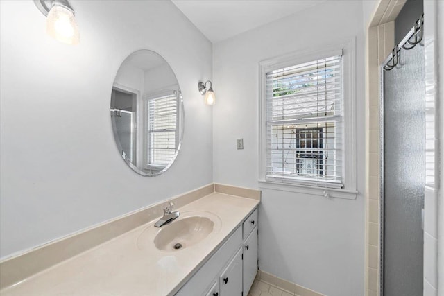 bathroom featuring vanity and a shower