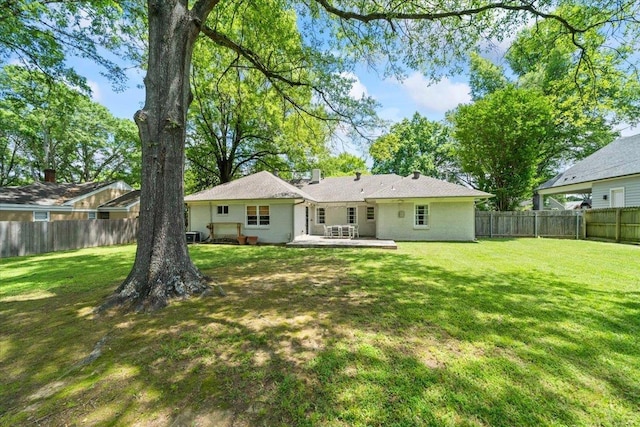 back of house with a patio area