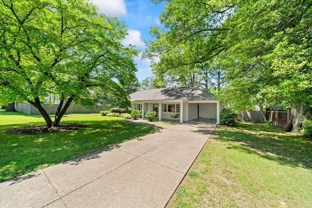 single story home featuring concrete driveway, a carport, and a porch