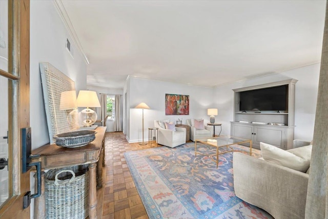 living area with crown molding