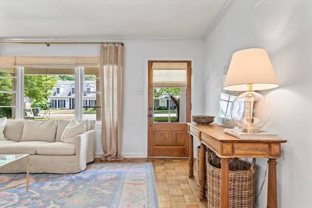 doorway to outside featuring crown molding and baseboards