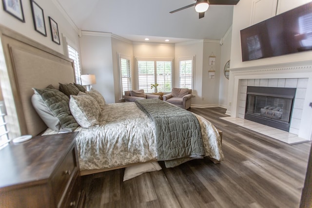 bedroom featuring vaulted ceiling, crown molding, dark wood-type flooring, multiple windows, and recessed lighting