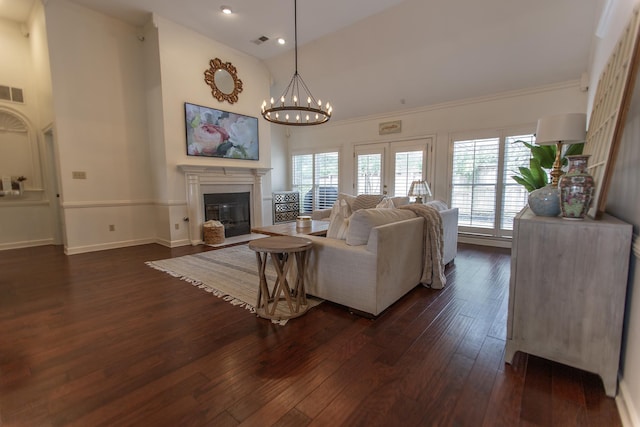 living area featuring dark wood-style flooring, high vaulted ceiling, a fireplace with flush hearth, baseboards, and recessed lighting