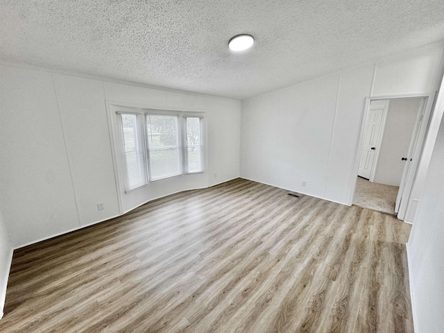 841 Simmons Rd, Munford, TN 38023 - spare room featuring a textured ceiling and wood finished floors