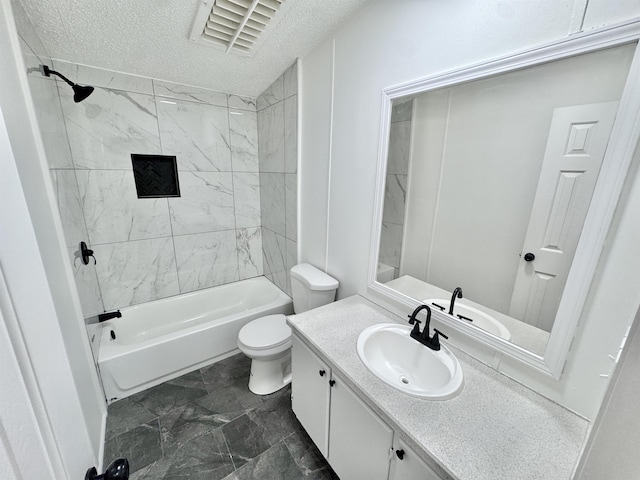 841 Simmons Rd, Munford, TN 38023 - bathroom featuring a textured ceiling, toilet, bathing tub / shower combination, and vanity