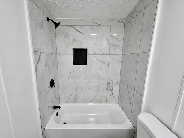 841 Simmons Rd, Munford, TN 38023 - full bathroom with a textured ceiling, toilet, and shower / washtub combination