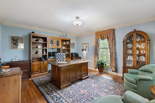home office with wood finished floors and ornamental molding