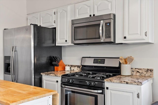 3686 Charleswood Ave, Memphis, TN 38122 - kitchen featuring stainless steel appliances and white cabinetry