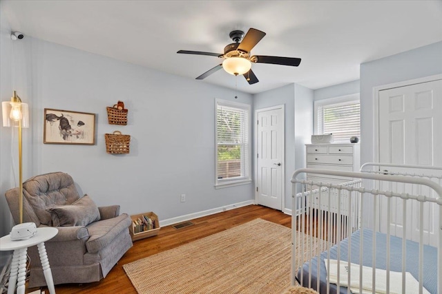 3686 Charleswood Ave, Memphis, TN 38122 - bedroom with multiple windows, wood finished floors, and baseboards