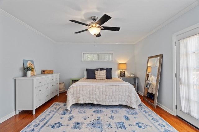 3686 Charleswood Ave, Memphis, TN 38122 - bedroom with wood finished floors, ornamental molding, a ceiling fan, and baseboards
