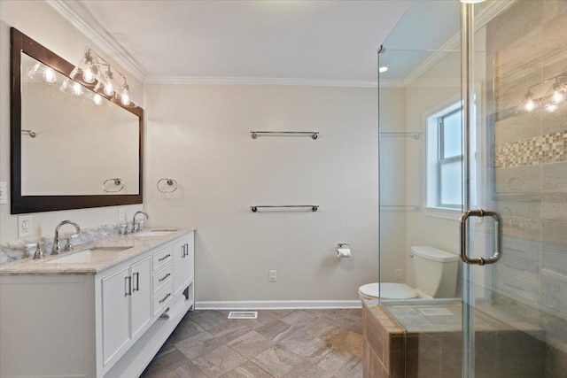 3686 Charleswood Ave, Memphis, TN 38122 - bathroom with crown molding, double vanity, a shower stall, toilet, and baseboards