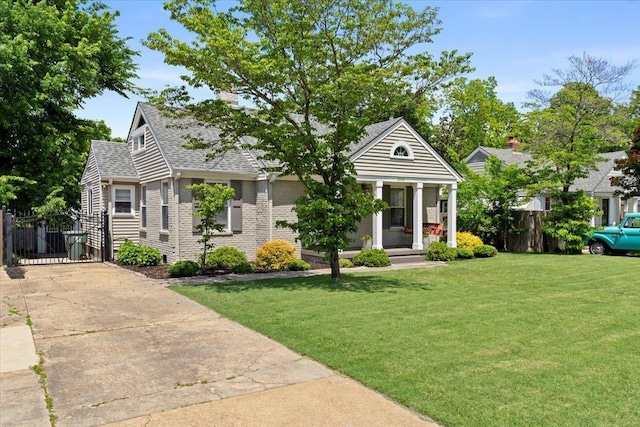 3686 Charleswood Ave, Memphis, TN 38122 - view of front of home featuring a porch, a gate, roof with shingles, and brick siding