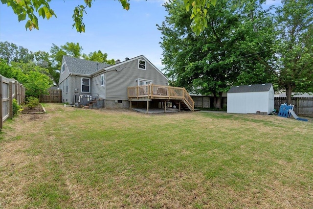 3686 Charleswood Ave, Memphis, TN 38122 - back of house with a wooden deck, stairway, an outdoor structure, and a storage unit