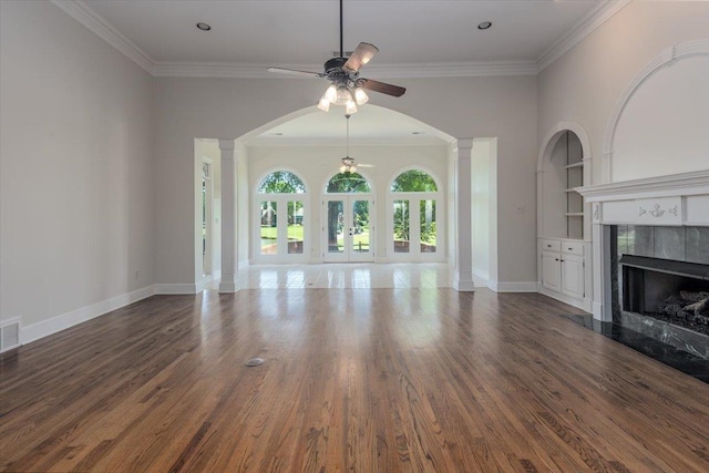 10336 Hatcher Patch Cv, Collierville, TN 38017 - unfurnished living room featuring ceiling fan, a premium fireplace, ornate columns, ornamental molding, and wood finished floors