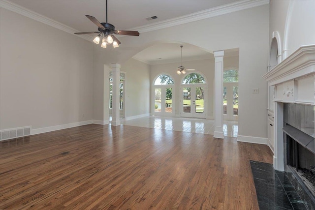 10336 Hatcher Patch Cv, Collierville, TN 38017 - unfurnished living room featuring a ceiling fan, a tile fireplace, wood finished floors, crown molding, and baseboards