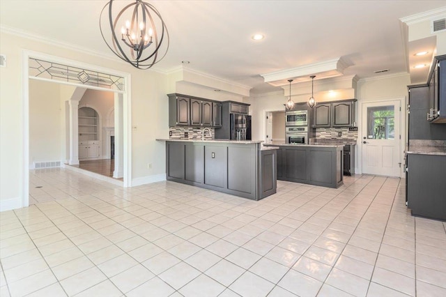 10336 Hatcher Patch Cv, Collierville, TN 38017 - kitchen with stainless steel appliances, ornamental molding, a peninsula, a chandelier, and backsplash