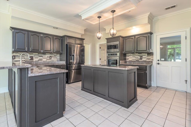10336 Hatcher Patch Cv, Collierville, TN 38017 - kitchen with stainless steel appliances, tasteful backsplash, light stone counters, ornamental molding, and a peninsula