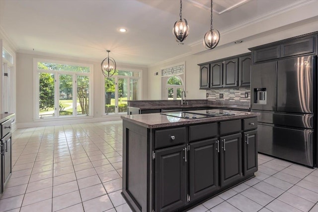 10336 Hatcher Patch Cv, Collierville, TN 38017 - kitchen featuring refrigerator with ice dispenser, a chandelier, light tile patterned floors, crown molding, and stovetop with downdraft