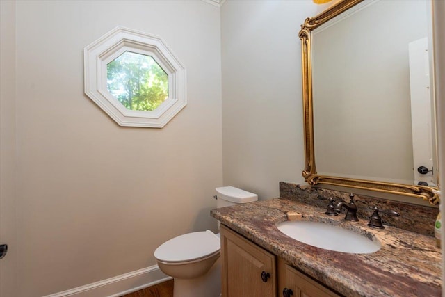 10336 Hatcher Patch Cv, Collierville, TN 38017 - half bathroom featuring toilet, vanity, wood finished floors, and baseboards