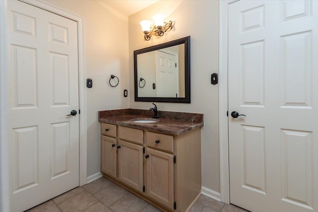 10336 Hatcher Patch Cv, Collierville, TN 38017 - bathroom with baseboards, vanity, and tile patterned floors