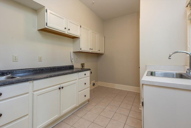 10336 Hatcher Patch Cv, Collierville, TN 38017 - kitchen featuring a sink, white cabinets, baseboards, and light tile patterned floors