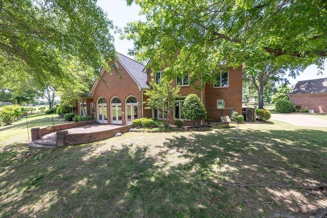 10336 Hatcher Patch Cv, Collierville, TN 38017 - rear view of property with french doors, brick siding, and a yard