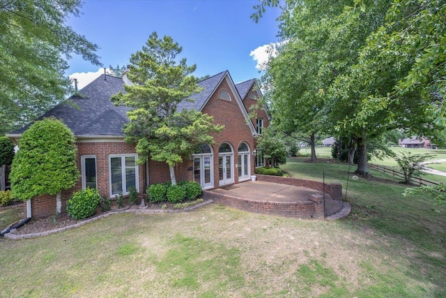 10336 Hatcher Patch Cv, Collierville, TN 38017 - rear view of property featuring french doors, brick siding, a patio area, and a shingled roof