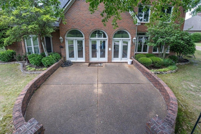 10336 Hatcher Patch Cv, Collierville, TN 38017 - rear view of house featuring french doors, brick siding, and a lawn