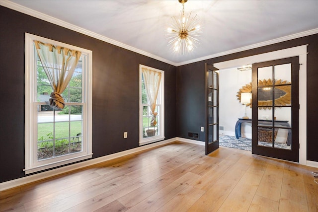 1366 Kirby Rd, Memphis, TN 38120 - unfurnished room with a chandelier, baseboards, light wood-type flooring, plenty of natural light, and ornamental molding