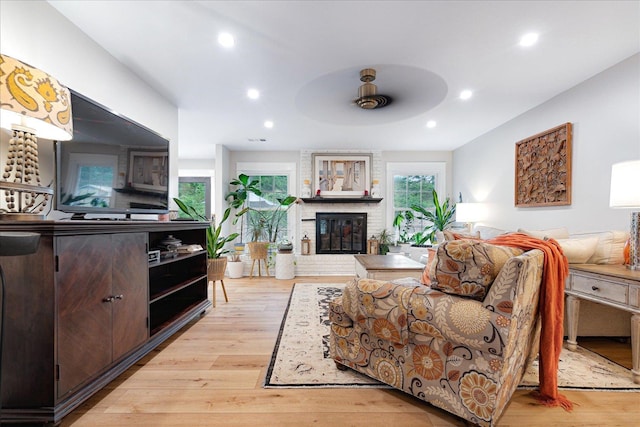 1366 Kirby Rd, Memphis, TN 38120 - living room featuring wood finished floors, a brick fireplace, and recessed lighting