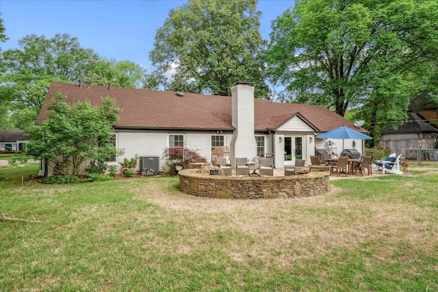 1366 Kirby Rd, Memphis, TN 38120 - rear view of house featuring a chimney, a patio, outdoor lounge area, and brick siding