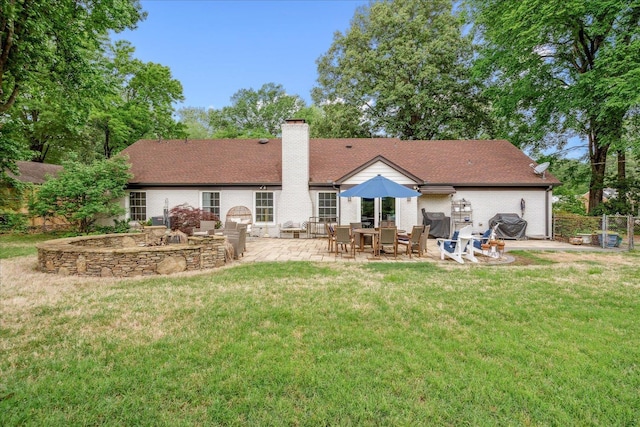 1366 Kirby Rd, Memphis, TN 38120 - back of property featuring a patio, a chimney, and brick siding