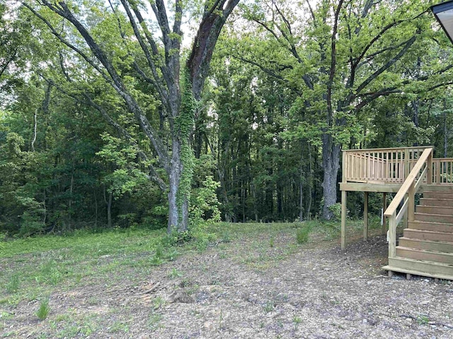 4403 W 19th Hwy, Ripley, TN 38063 - view of yard featuring stairs, a wooden deck, and a view of trees