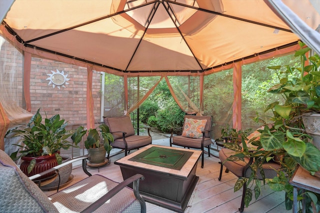 8792 E Carrollwood Ln E, Memphis, TN 38016 - sunroom featuring lofted ceiling and an outdoor living space with a fire pit
